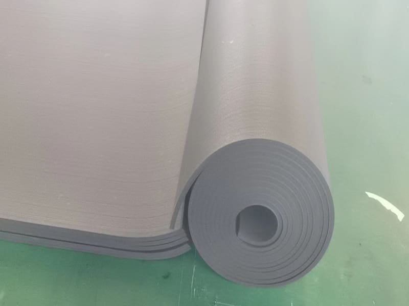 A close-up of a dense, non-porous vulcanized rubber floor tile